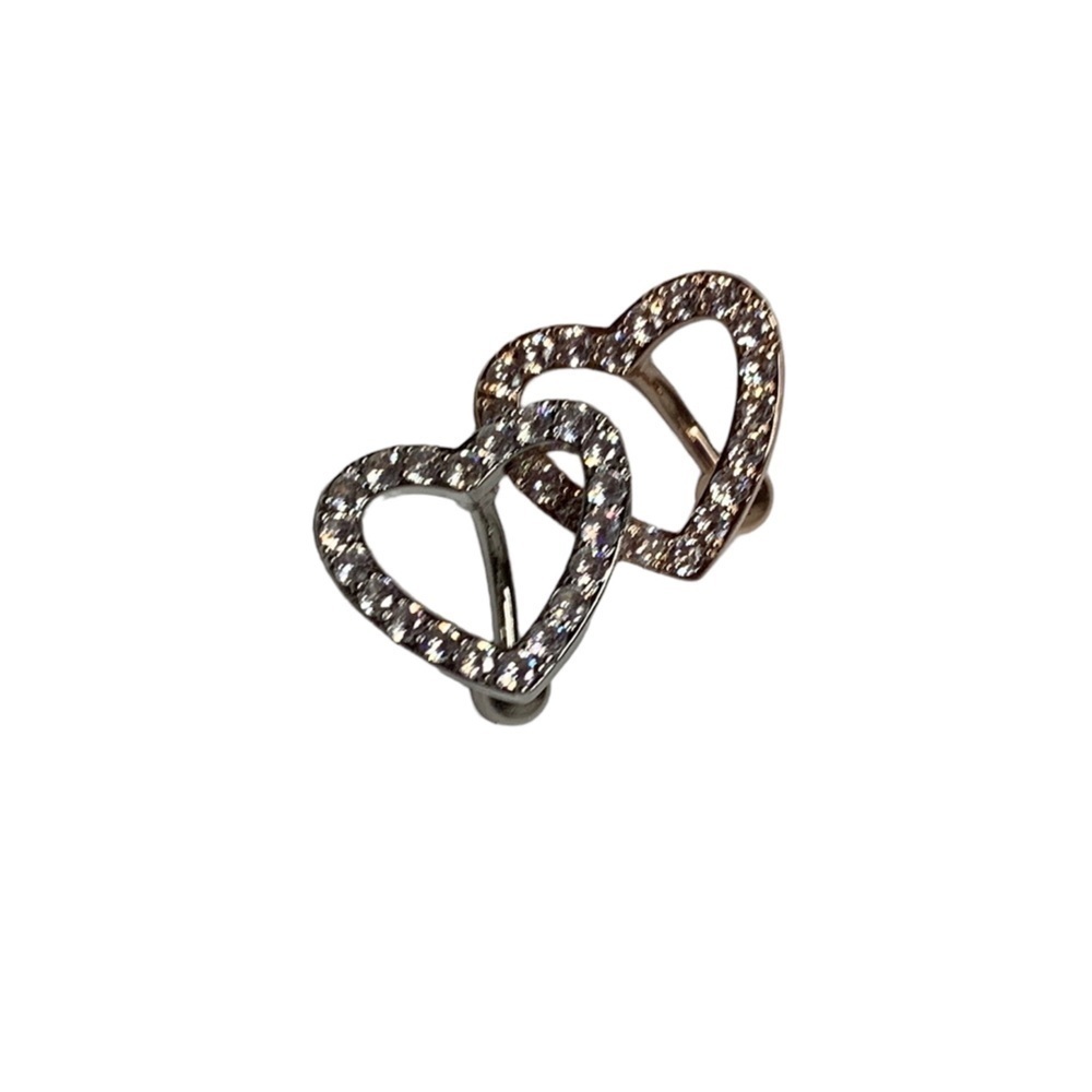 Silver and rose gold belly button piercings